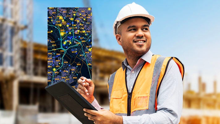 A man outside near a construction site, wearing a helmet and high-visibility vest, holding a tablet that is displaying a detailed map