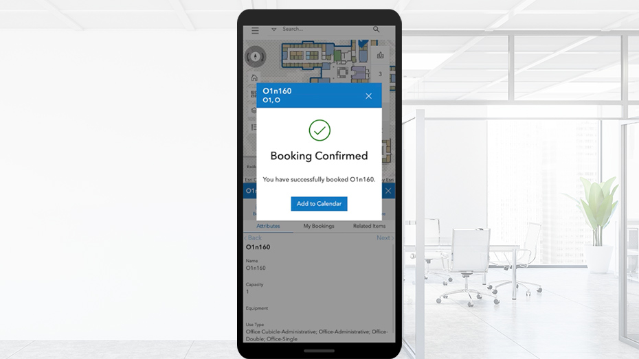 A mobile phone screen with a popup window saying booking confirmed in ArcGIS Indoors Spaces,A mobile phone screen with a popup window saying booking confirmed in ArcGIS Indoors Spaces