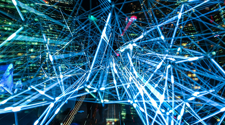 A complex network of glowing blue lines on a black background