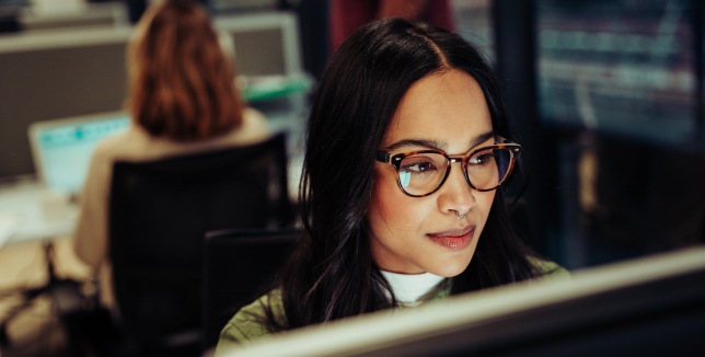 woman working on a PC in an office setting