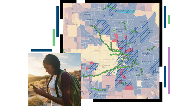 Hiker looking at her cell phone and a map of recreation areas