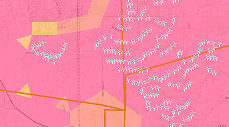 A pink model of a wind farm with locations of turbines and areas marked with yellow