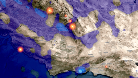 A 3D elevation map of a mountainous area shaded in gray, purple, and blue