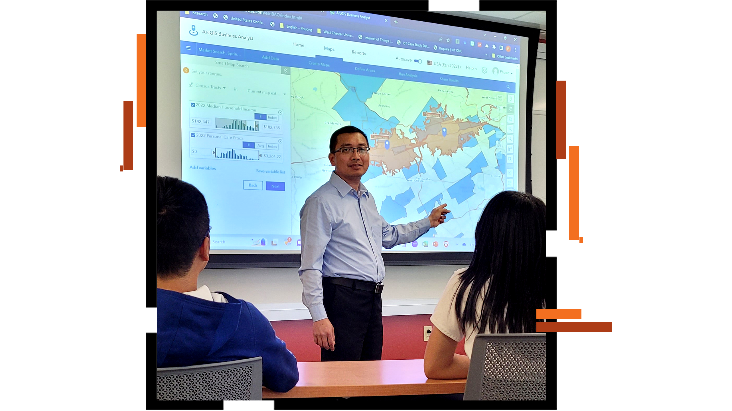 A teacher pointing at a map on a projection screen as two students look on